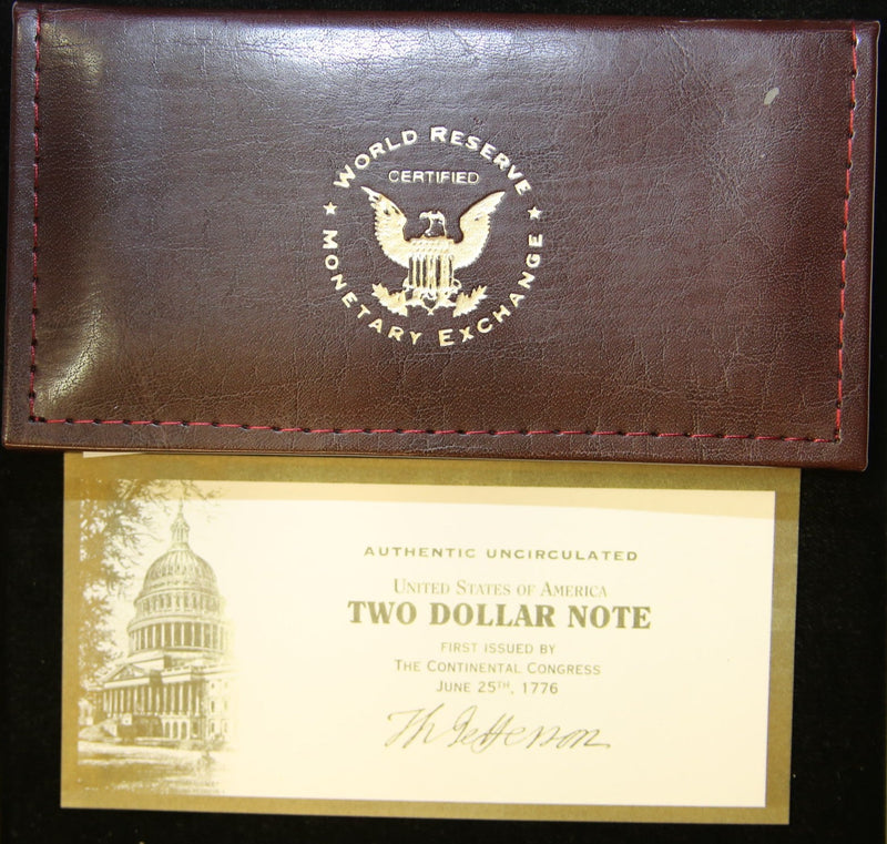2003 Uncirculated $2 note & World Reserve Monetary Exchange Leather Bill protector. Store