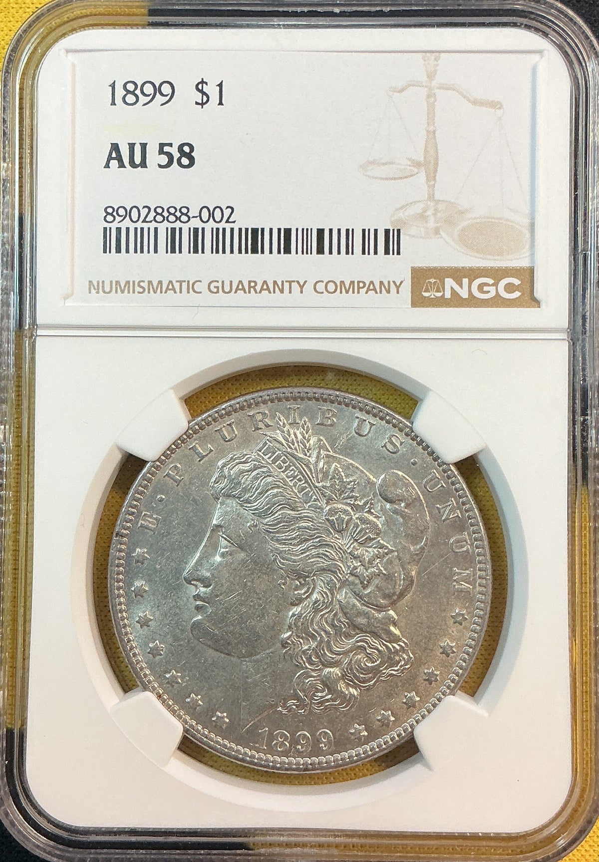 1899 Morgan Silver Dollar, NGC AU 58, Store #DR0522