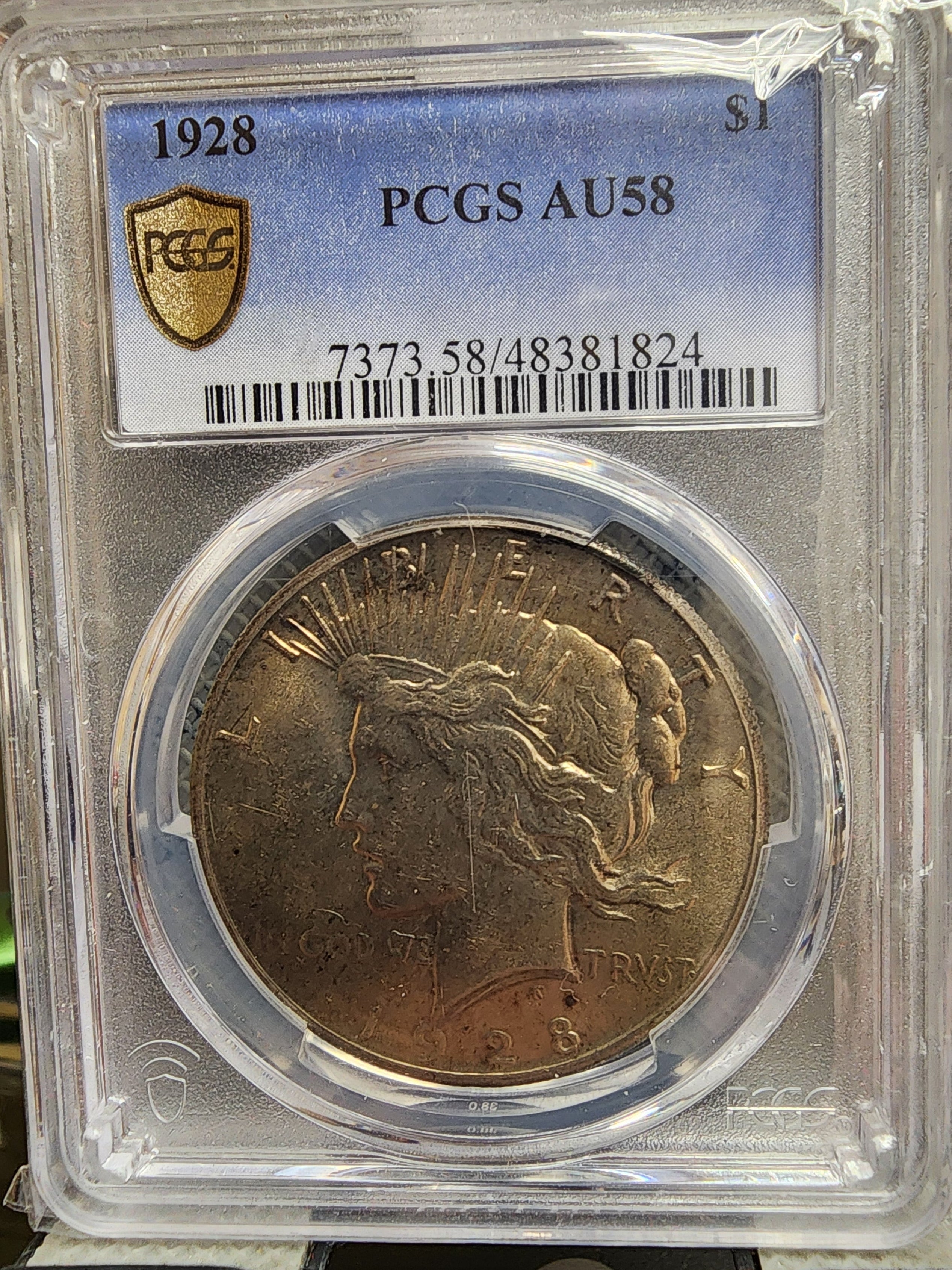 1928 Peace Silver Dollar., PCGS AU-58. Slider, 'Key Date Coin', Store #DR0649