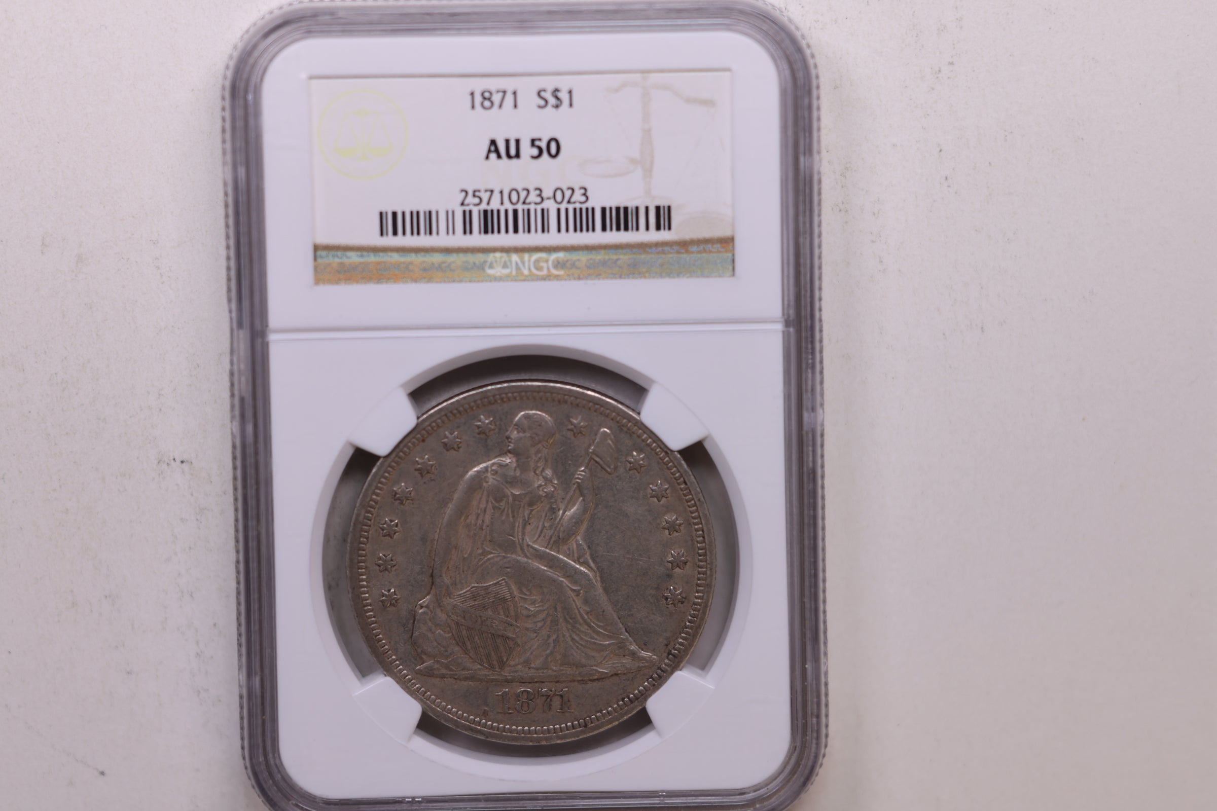 1871 Seated Liberty Silver Dollar, Circulated, NGC AU-50, Store #GDR0303.