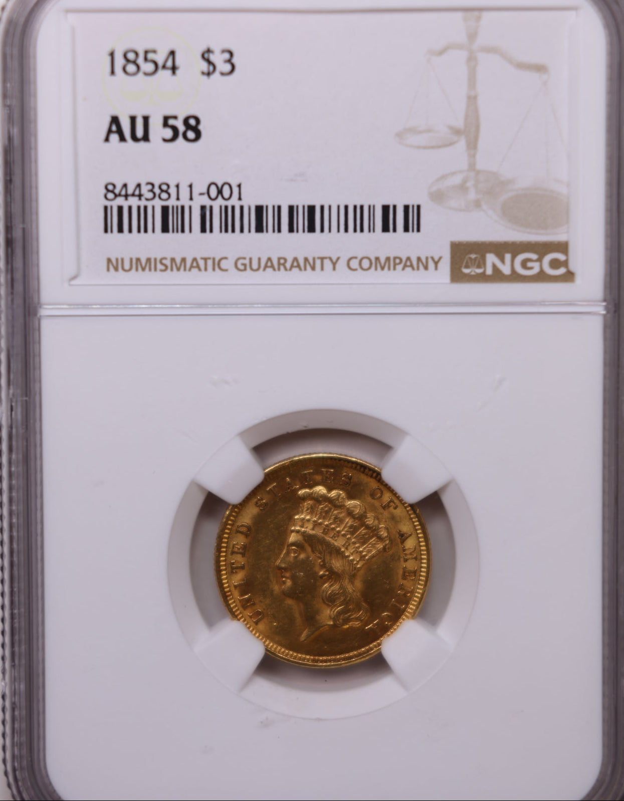 An NGC graded gold coin in a clear plastic holder against a plain light background. The coin is labeled 1854 $3 AU 58 and features a gold-toned metallic finish.