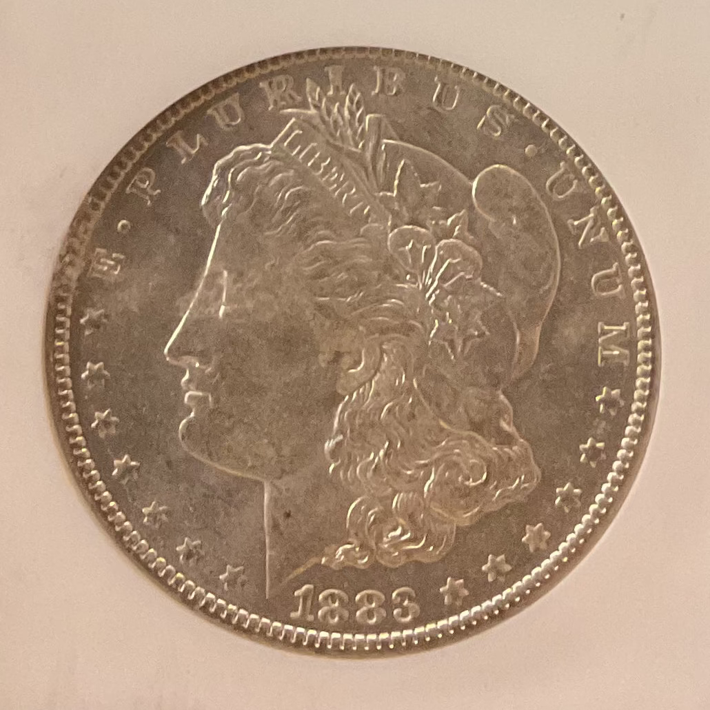 1883-O Morgan Silver Dollar, NGC Graded MS 64 UNC.  Store #DR1577
