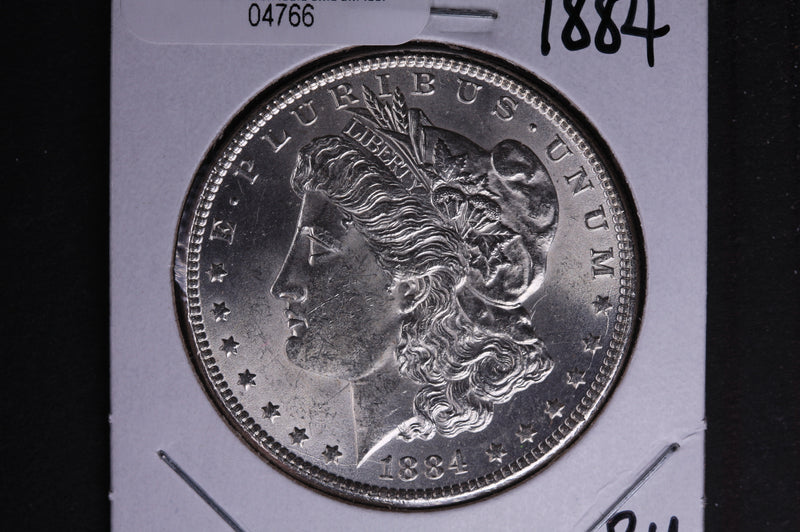 1884 Morgan Silver Dollar, Brilliant Un-Circulated condition. Coin Store